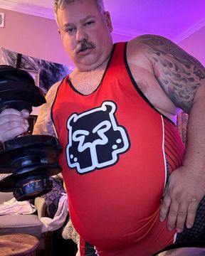 Giant Man in Wrestling Uniform Has Massive Release Hands Free