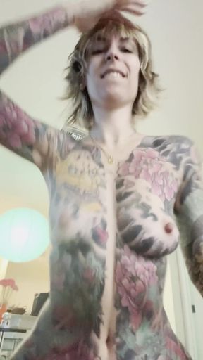 Tattooed woman in body paint