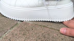 My neighbor trampling My hand ( sneakers)