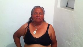 Mature grey haired slut with ugly fat belly and big rack stripteased on cam