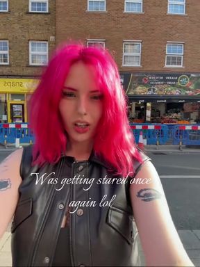 White girl in leather shows off pink hair and pierced nipples