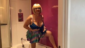 Pee in a hotel bath in rainbow skirt!