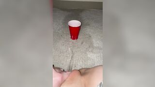 Piss spray inside solo cup