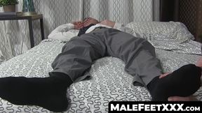 Hunk while man sniffs and licks his feet