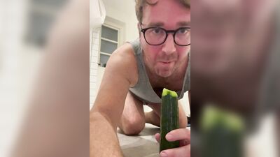 Perverted chap is shoving a cucumber deep down his tight hole