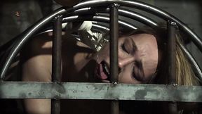 Blonde maid takes a hard tongue licking while pissing in her cage