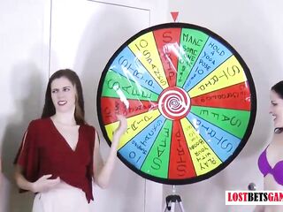3 very marvelous beauties play a game of disrobe spin the wheel