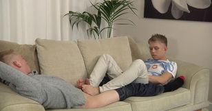 Amateur boys mix foot fetish with blowjob on the living room couch
