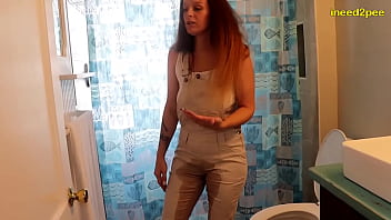 Natalie Charm pissing her tight overalls omorashi