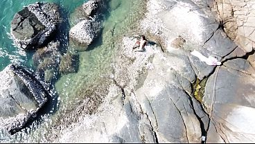 Nudist girl masturbation on rocky beach # Drone Voyeur