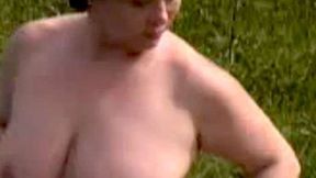 ”A sexy fatty masturbates outdoors”