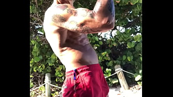 BICEP FLEXING AT THE BEACH
