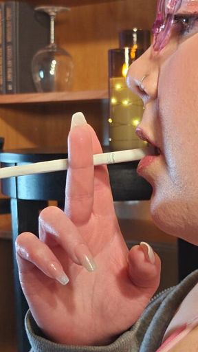 Smoking a VS menthol 120 in a close up profile view