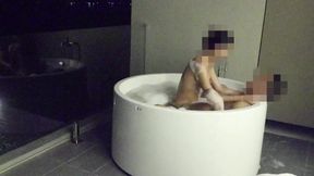 Asian couple having sex in an outdoor jacuzzi &mdash;  someone is peeking