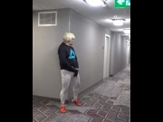 athlete in tights takes his cock out in hotel hall