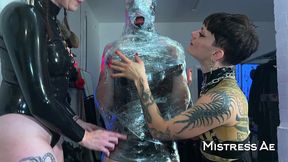 princess latex rubber doll mummified and edged while standing
