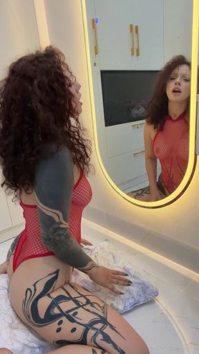 Amateur girl rides a pillow dressed in fishnets