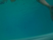 Twink loses trunks in hotel pool and swims naked