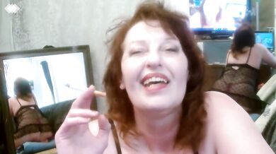 Redhead smoking in black babydoll nightie