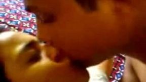 Really beautiful Indian young girlfriend with her boyfriend on the bed