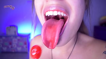 Cute girl licking and sucking a lollipop