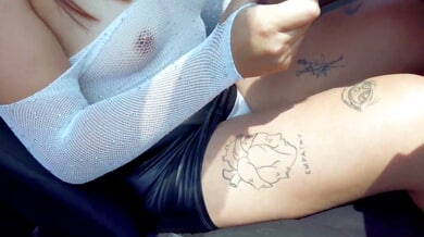 Curvy tattooed woman in leather skirt gives stranger oral in car doorway