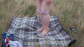Bitch Masturbates Pussy With a Toy in the Field