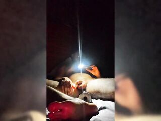 Young straight man masturbates while watching gay porn in the evening light