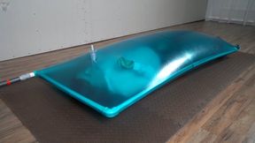 Blue inflatable latex vacuum bed for Sonya with a breathing dildo