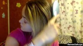 Brushing short blonde hair