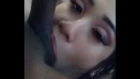 Eva Yi stuffs black balls in her mouth