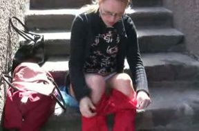 Her red tight jeans are warm and wet after pissing