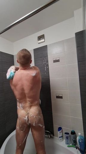 Muscular guy with big dick showering, jerking off and eating cum