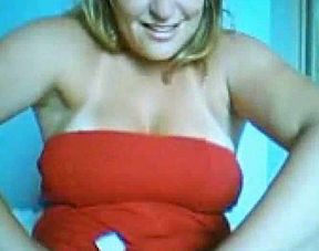 A slutty Brazilian blondie in red dress shows it all on webcam