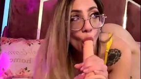 Sexy blonde deepthroating a big dildo!