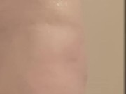 Milf seductively showers and plays with large, pierced breasts and horny, pierced pussy
