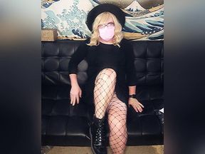 Blonde trans girl putting on fishnets