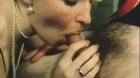 Charming slender vintage brunette in black lingerie gives blowjob