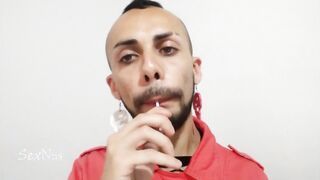 Eagerly sucking on a foodstuff while being spitted on by a lucky dude