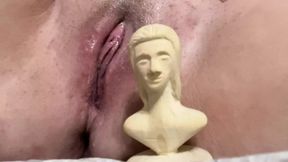 The whore fucks herself with something