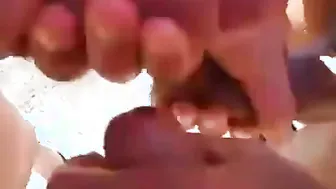 Three Men Sucking Cock on a Public Beach