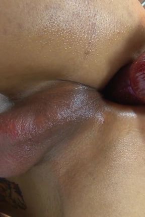A Thai shemale named Noon uses a vibrator in her ass