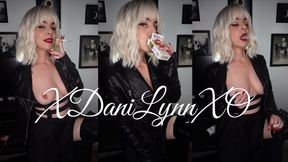 Smoking Wearing Leather Jacket and Skirt