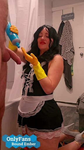 Chubby Milf Maid Bound Ember, gives handjob to hotel guest in rubber gloves then takes a cumshot facial