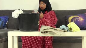 ”Bushy female in hijab doing extra cleaning”