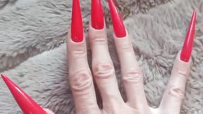 Extremely long RED nails. I want to play with your dick and scratch it