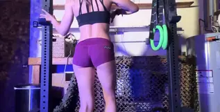 Strong blonde GF pulls herself up a fence using only her strength and body