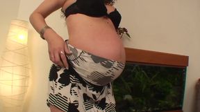 Brunette is pregnant with hairy pussy