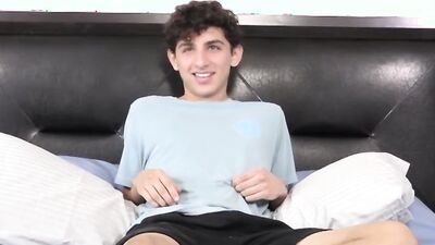 Twink strips naked after an interview and jerks off solo