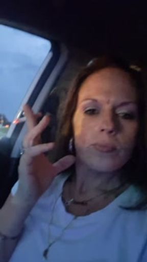Riding in the car and doing selfie of me smoking cigarette